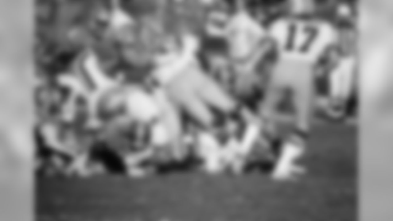 Randy Gradishar (53) of the Denver Broncos leads the defensive surge during a game against the Green Bay Packers on Jan. 11, 1979. Gradishar has been chosen The Associated Press NFL Defensive Player of the Year. (AP Photo)