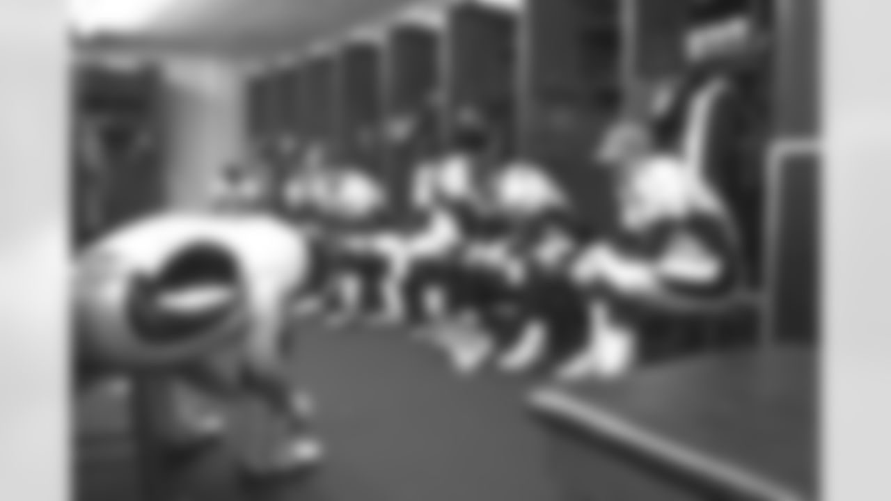 Kansas City: John Elway and his teammates relax before the game in the locker room against the Kansas City Chiefs at Arrowhead Stadium in Kansas City, MO on January 4, 1998.