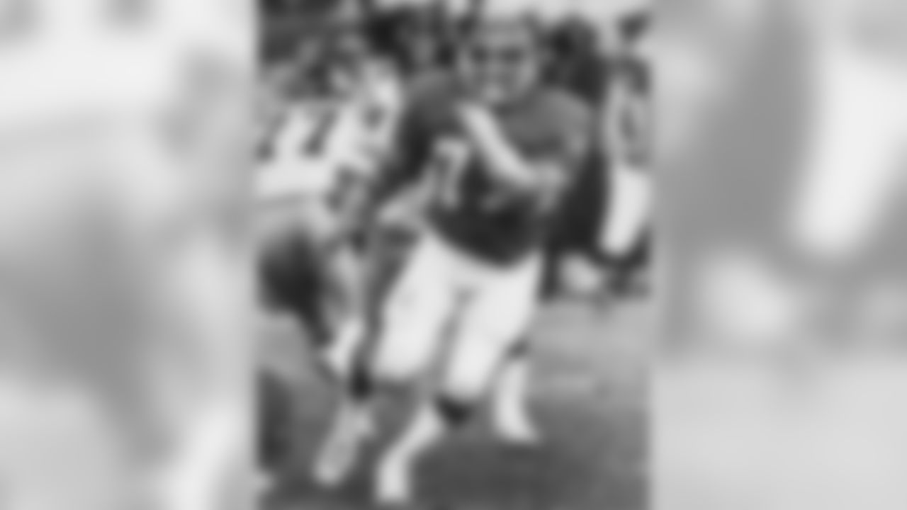 Defensive tackle Lyle Alzado rushes the Steelers quarterback during a game at Mile High Stadium.