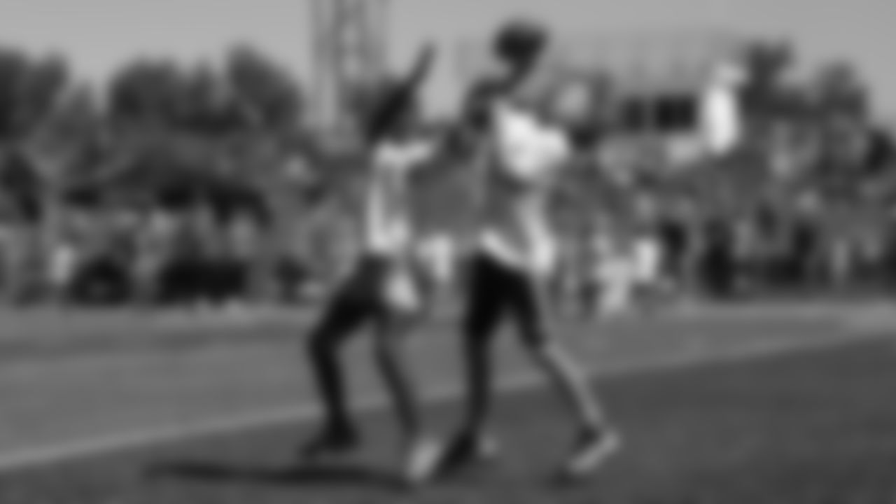 Children go one-on-one battling for a pass at Von Miller's youth football camp at Englewood High School on June 20, 2019.