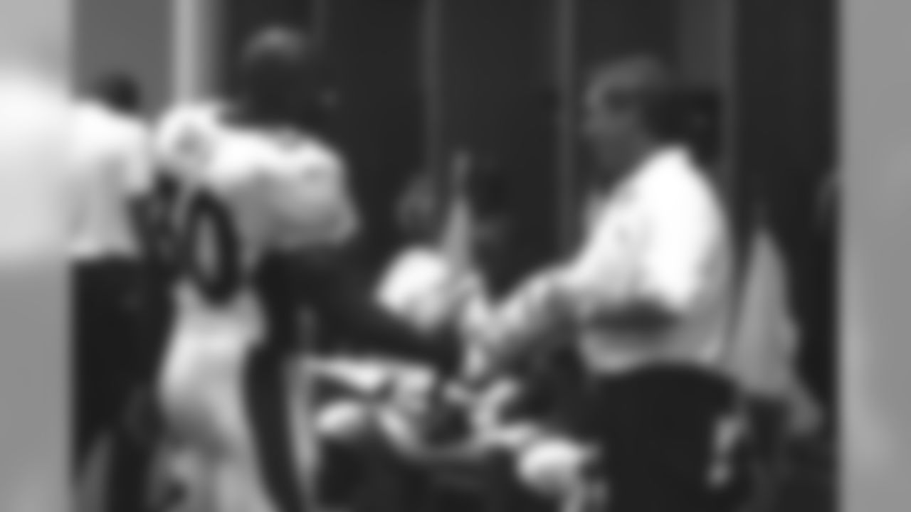 Mike Shanahan and Terrell Davis talk before the start of their season opener against the St. Louis Rams against the St. Louis Rams at Trans World Dome in St. Louis, MO on September 4, 2000.