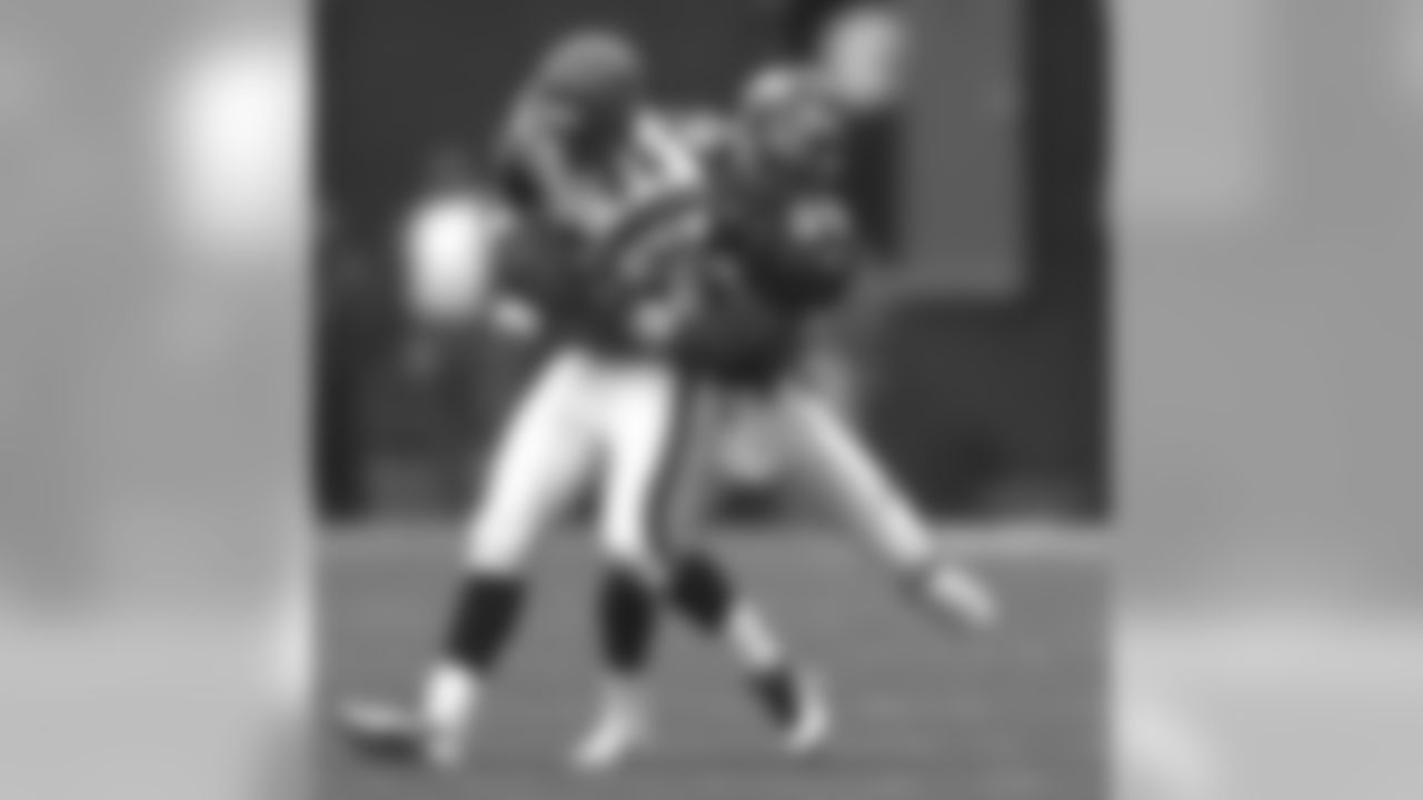 Denver: Ray Crockett makes a tackle against the Cincinnati Bengals at Mile High Stadium in Denver, CO on September 21, 1997.