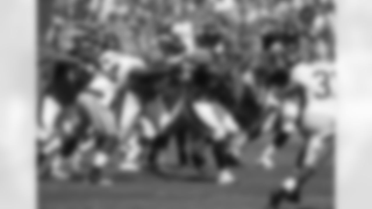 Running back Willis McGahee breaks through the San Francisco defense.