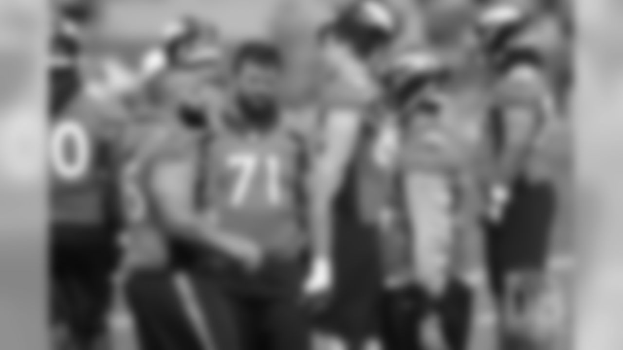 Guard Ron Leary talks with Nico Falah during the first day of voluntary veteran minicamp on April 16, 2019.