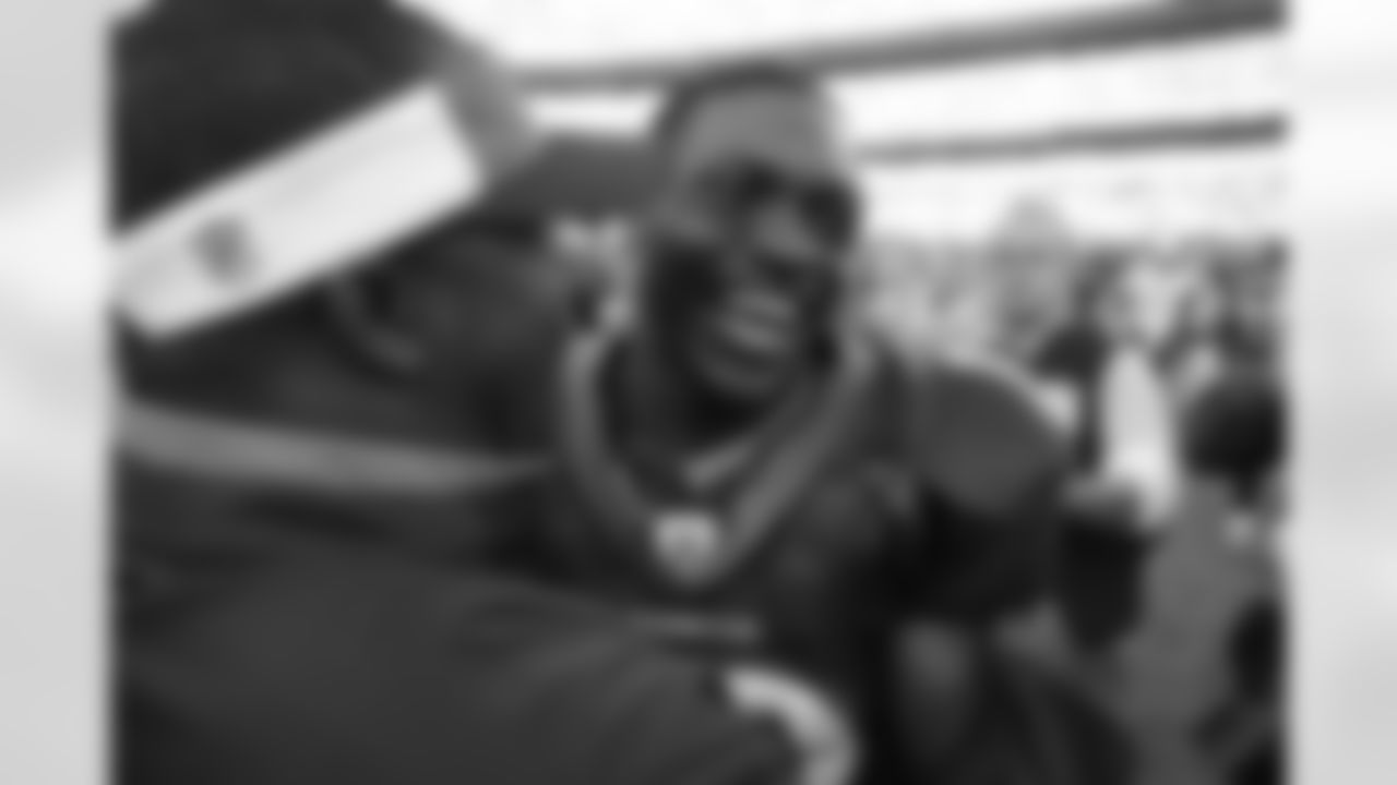 A smiling Eddie Royal is embraced on the field after he helped his team defeat San Diego Chargers at Invesco Field September 14, 2008