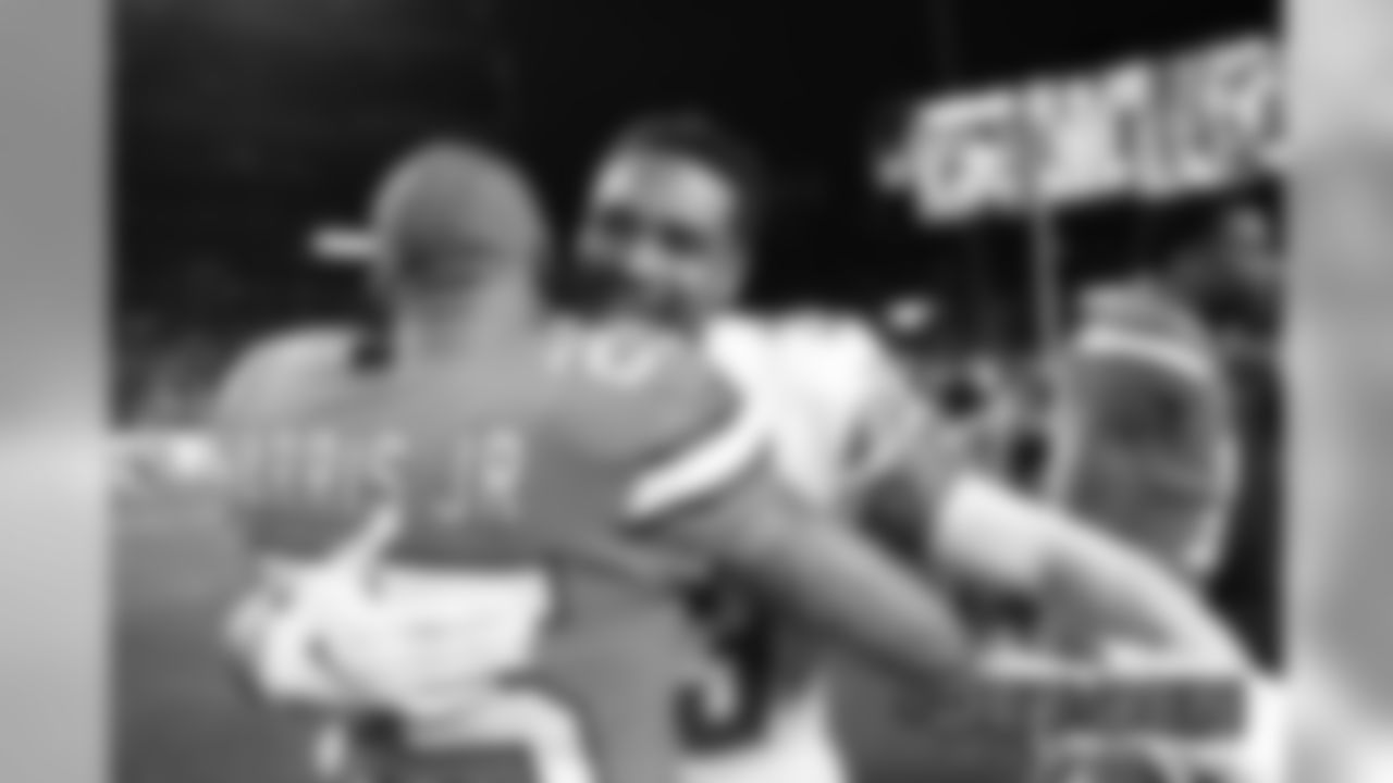 Chris Harris Jr. greets Detroit Lions cornerback Darius Slay (23) after the Broncos' game against the Detroit Lions at Empower Field at Mile High on December 22, 2019. (Photo by Ben Swanson)