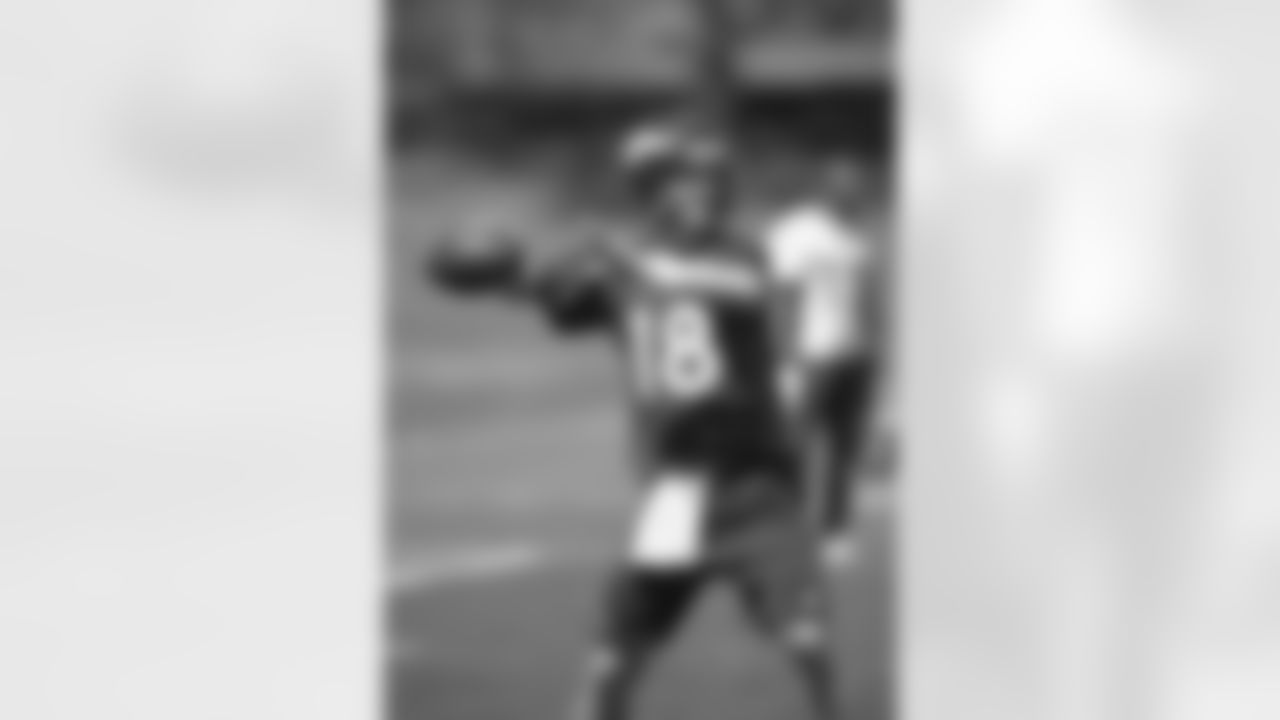 Manning throws a pass.