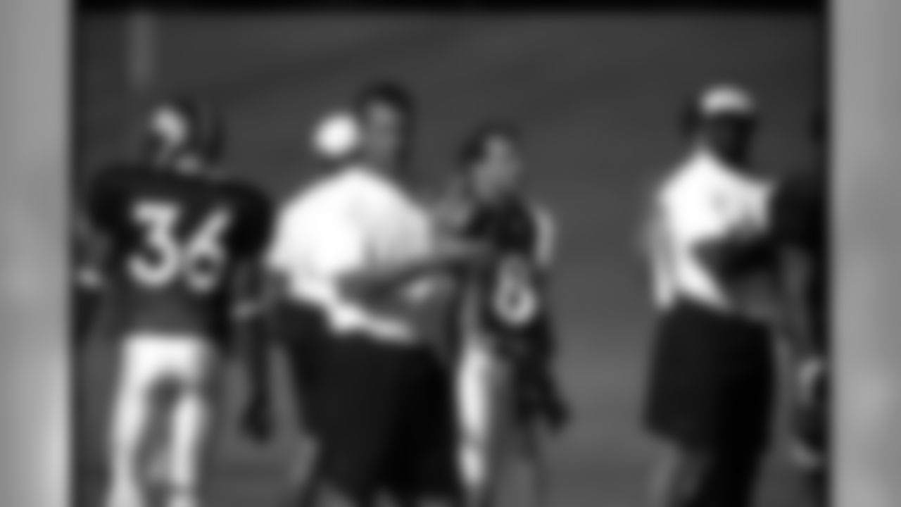 Then offensive coordinator Gary Kubiak watches a 2001 training camp practice in Greeley, Colorado.