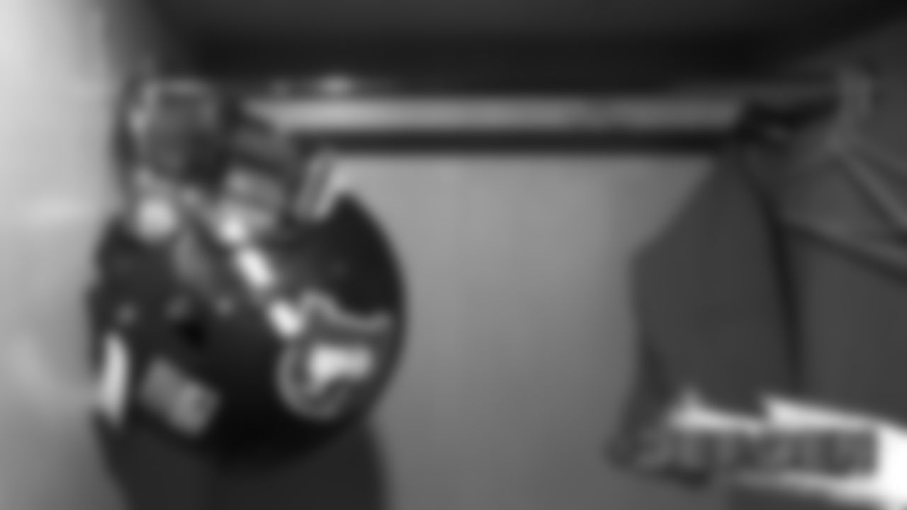 A helmet in the locker room before the Broncos' game against the Detroit Lions at Empower Field at Mile High on December 22, 2019. (Photo by Ben Swanson)