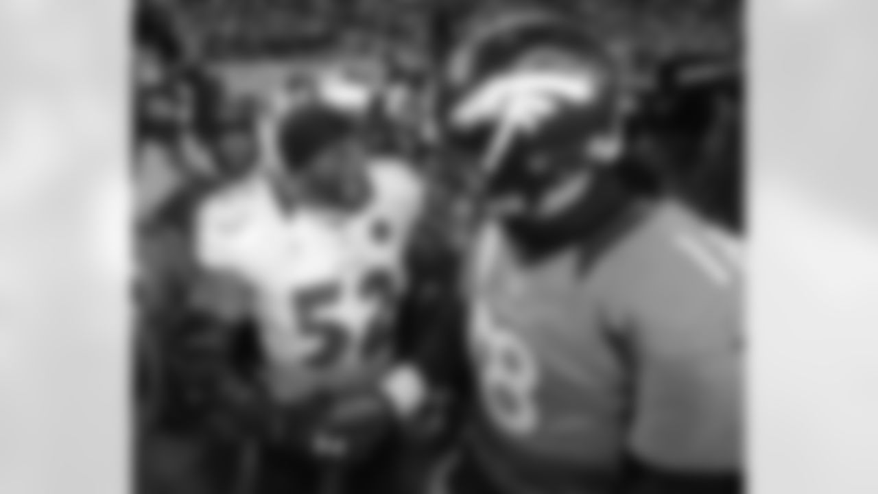 Manning and Lewis talk after the game.