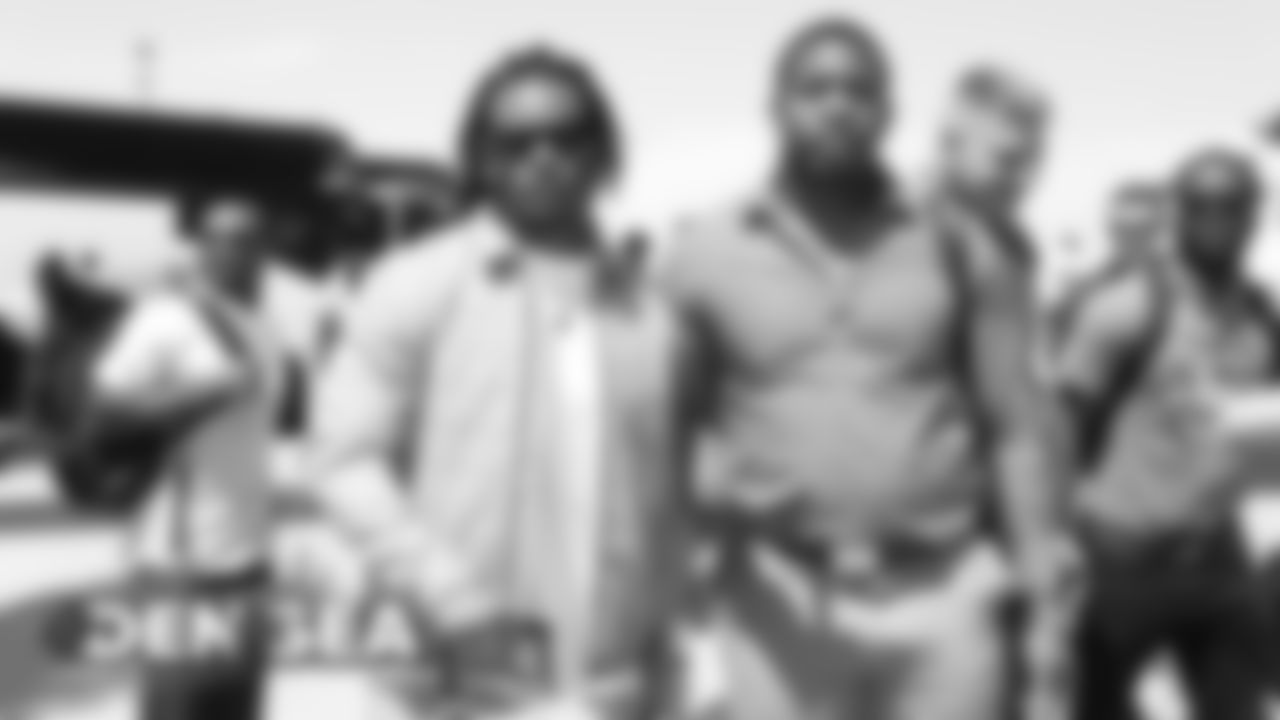 Todd Davis and DeMarcus Walker on the tarmac at Denver International Airport in Denver, Colorado, August 07, 2019.
Photo by Gabriel Christus