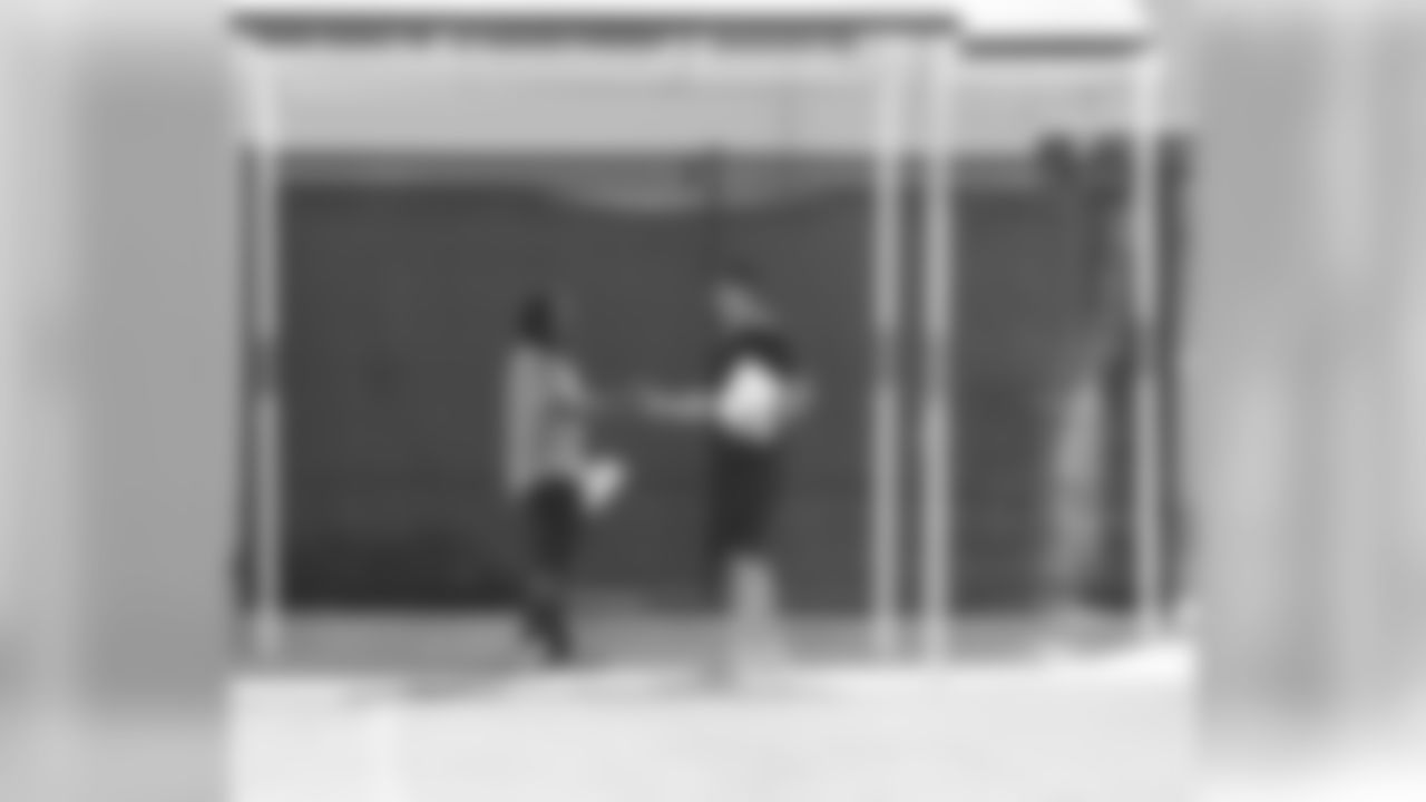 The two players greet each other.