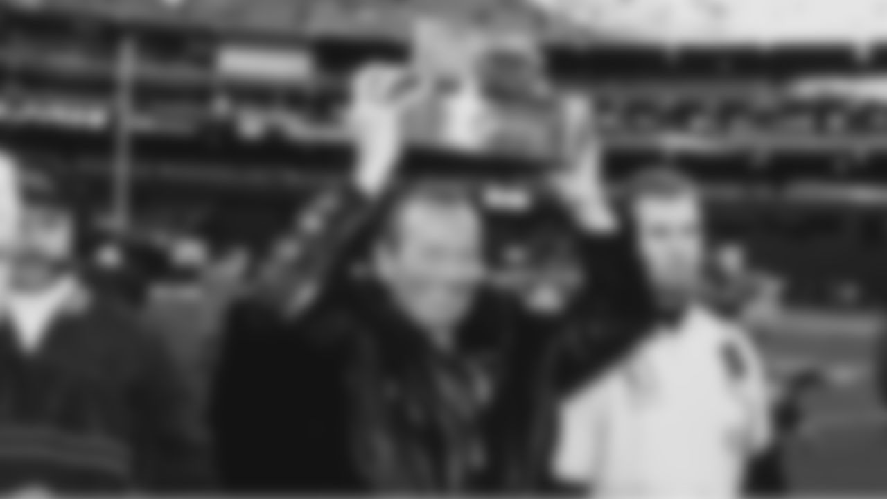 Owner Pat Bowlen carries off the AFC Championship trophy after the win against the Pittsburgh Steelers at Three Rivers Stadium in Pittsburgh, PA on January 11, 1998.