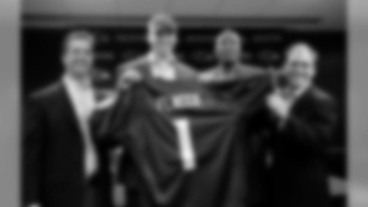Ravens first-round pick QB Joe Flacco holds his jersey, with head coach John Harbaugh, general manager Ozzie Newsome and director of college scouting Eric DeCosta (left to right), on April 27, 2008. Flacco, who played college football at Delaware, was selected by the Ravens with the 18th-overall pick. (AP Photo/Rob Carr)