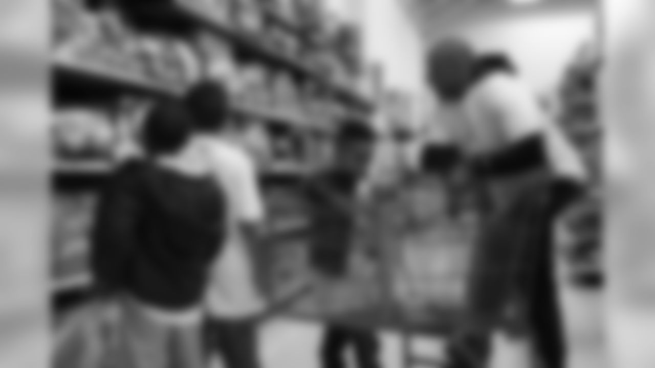 Chris Harris Jr. hosts his 2018 "Shop with a Jock" event, in which he gives 50 children a shopping spree and dinner.