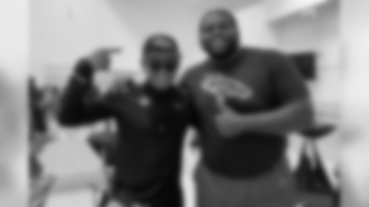 Zach Kerr takes a photo with a Broncos fan at the Tochito National Tournament on February 9, 2019, as a player ambassador for the flag football tournament.