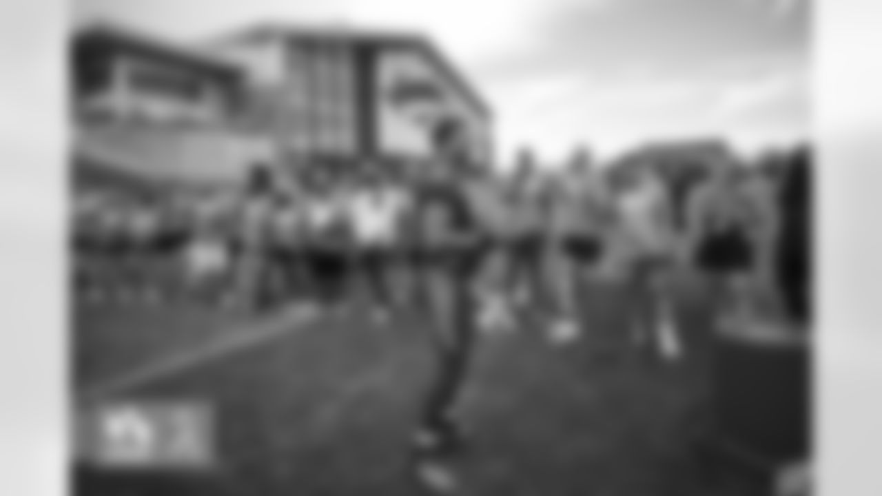 Russell Wilson conducts a competition with military members trying to hit the crossbar with a football during a USAA Salute to Service meet-and-greet session after practice at UCHealth Training Center in Englewood, Colorado on August 25, 2022. (Photo by Ben Swanson)