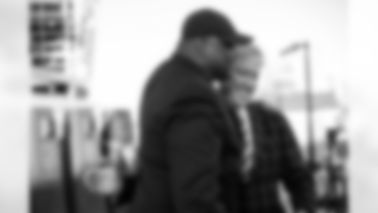 Neil Smith greets John Elway during the Alumni Weekend banquet in honor of the Ring of Fame induction of Mike Shanahan and the Pro Football Hall of Fame induction of Steve Atwater at Empower Field at Mile High in Denver, Colorado on October 15, 2021. (Photo by Ben Swanson)