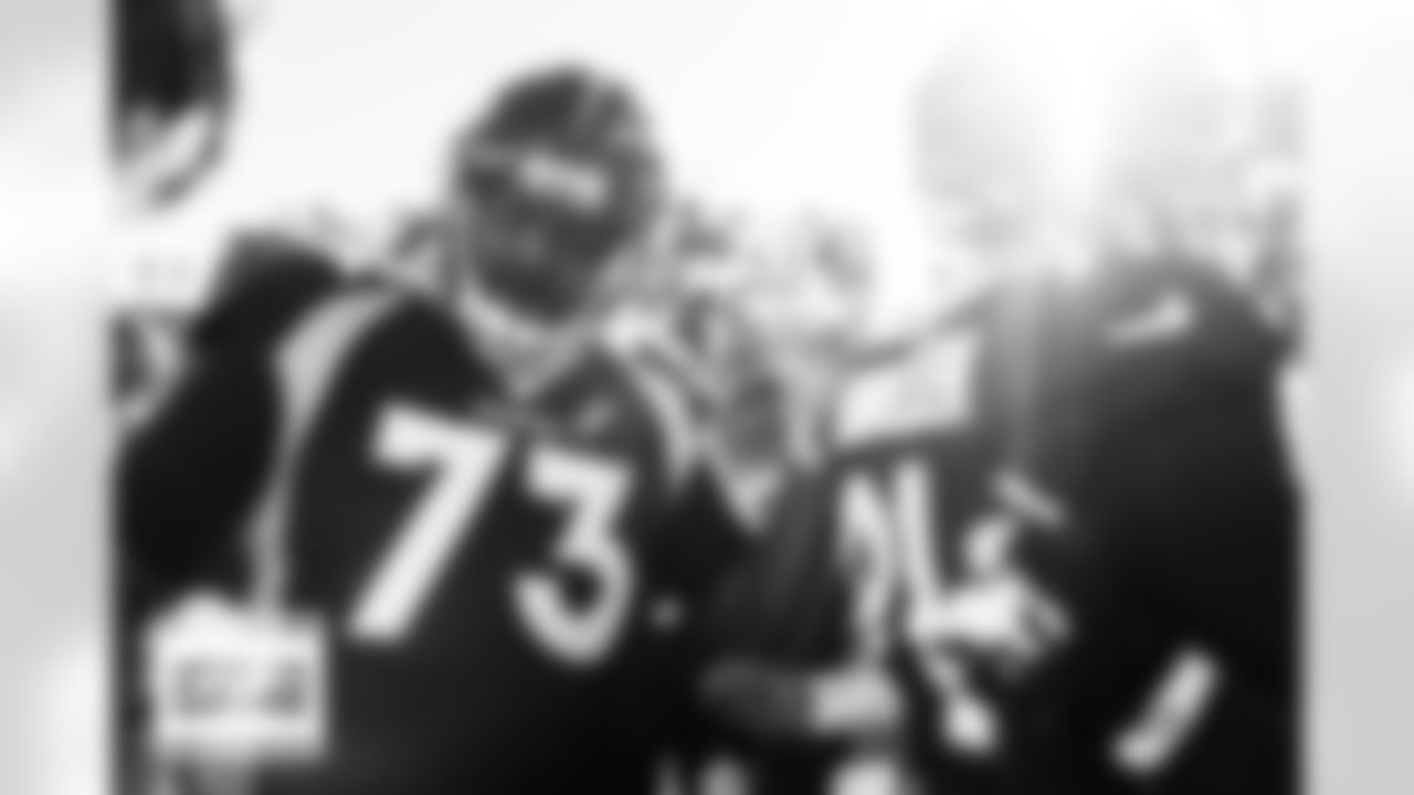 Russell Wilson speaks to the team in the huddle during pregame warmups before the Broncos' Week 14 game against the Kansas City Chiefs at Empower Field at Mile High in Denver, Colorado on December 11, 2022. (Photo by Ben Swanson)