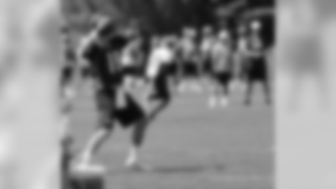 QB Peyton Manning throws a pass downfield.