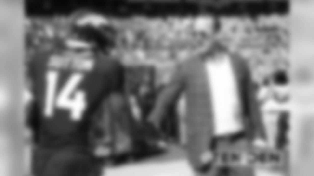 Peyton Manning greets Courtland Sutton before the Broncos' game against the Tennessee Titans at Empower Field at Mile High on October 13, 2019. (Photo by Ben Swanson)