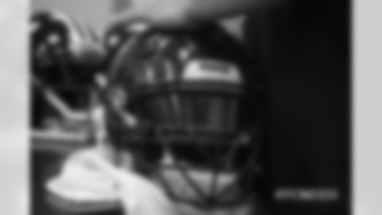 Inside the Broncos' equipment room as staffers transition helmets to the team's Color Rush set, applying new decals and throwback logos for the team's Week 12 game.