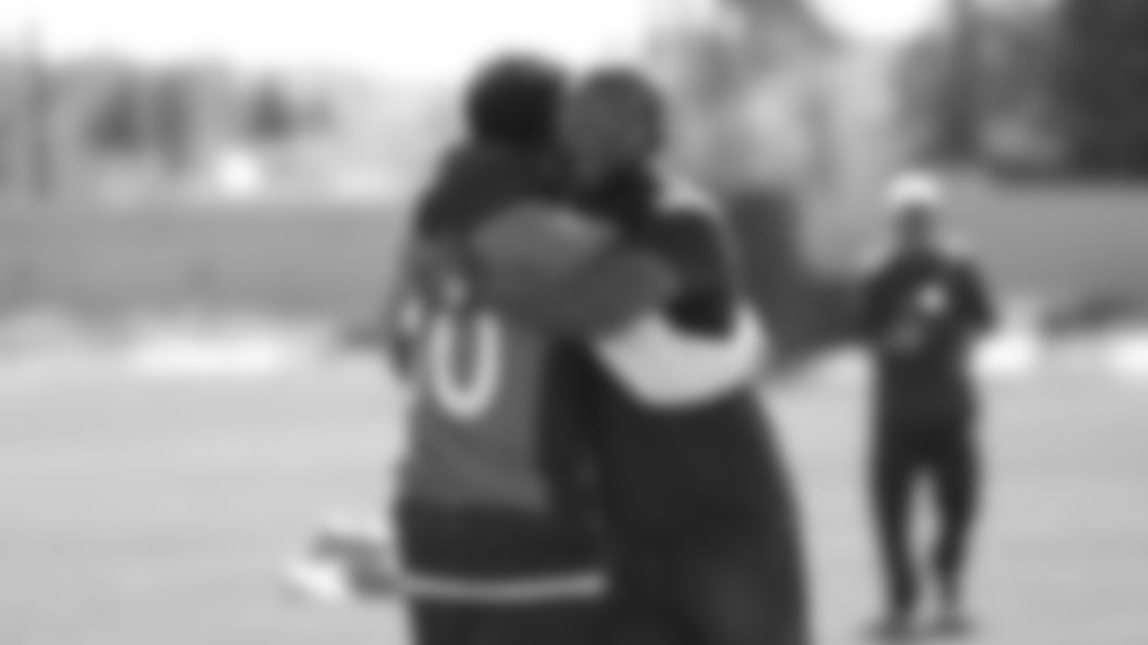 Emmanuel Sanders hugs Champ Bailey as Broncos alumni watch the team's walkthrough and meet with current players and coaches afterward on October 12, 2019. (Photo by Ben Swanson)