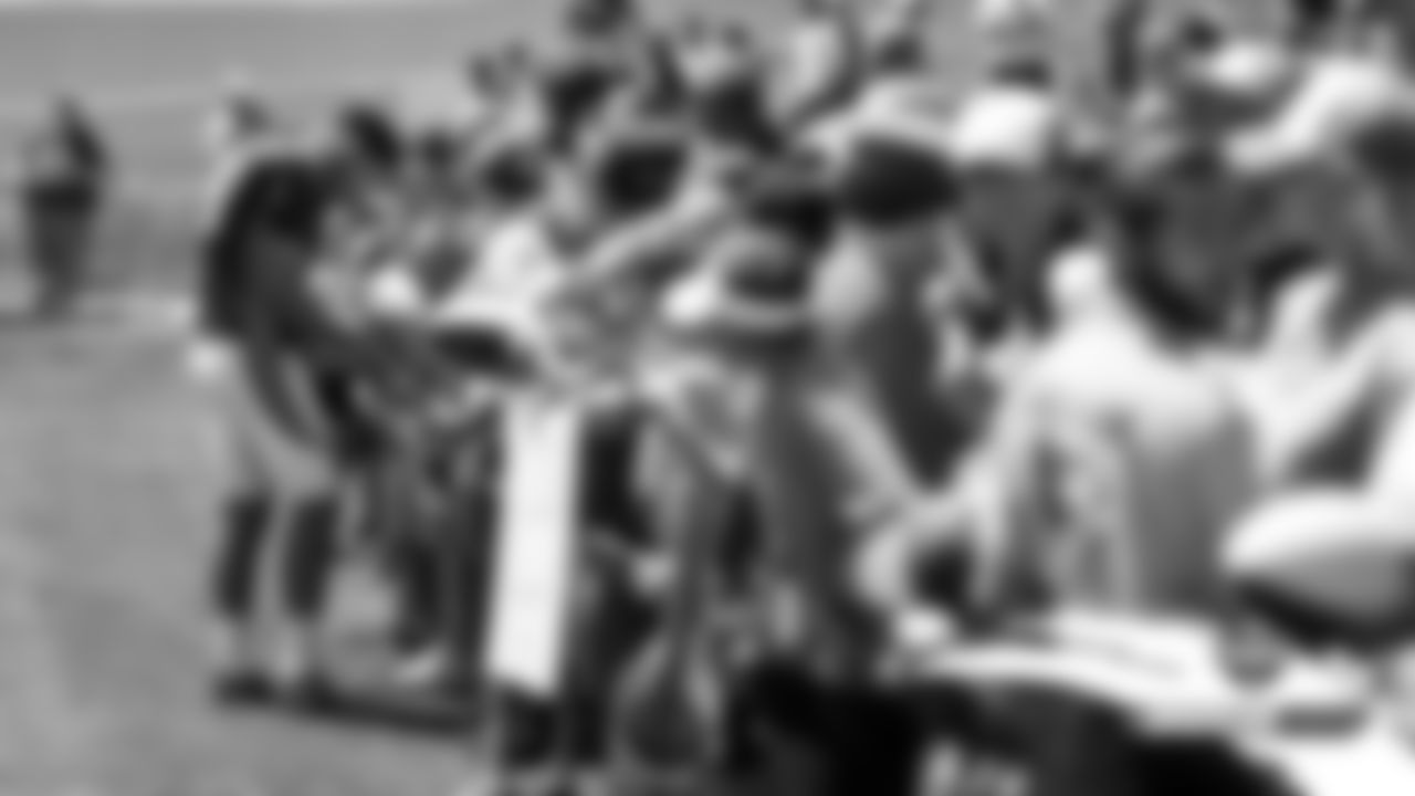 Joe Flacco signs autographs after practice on Day 12 of training camp on August 4, 2019.