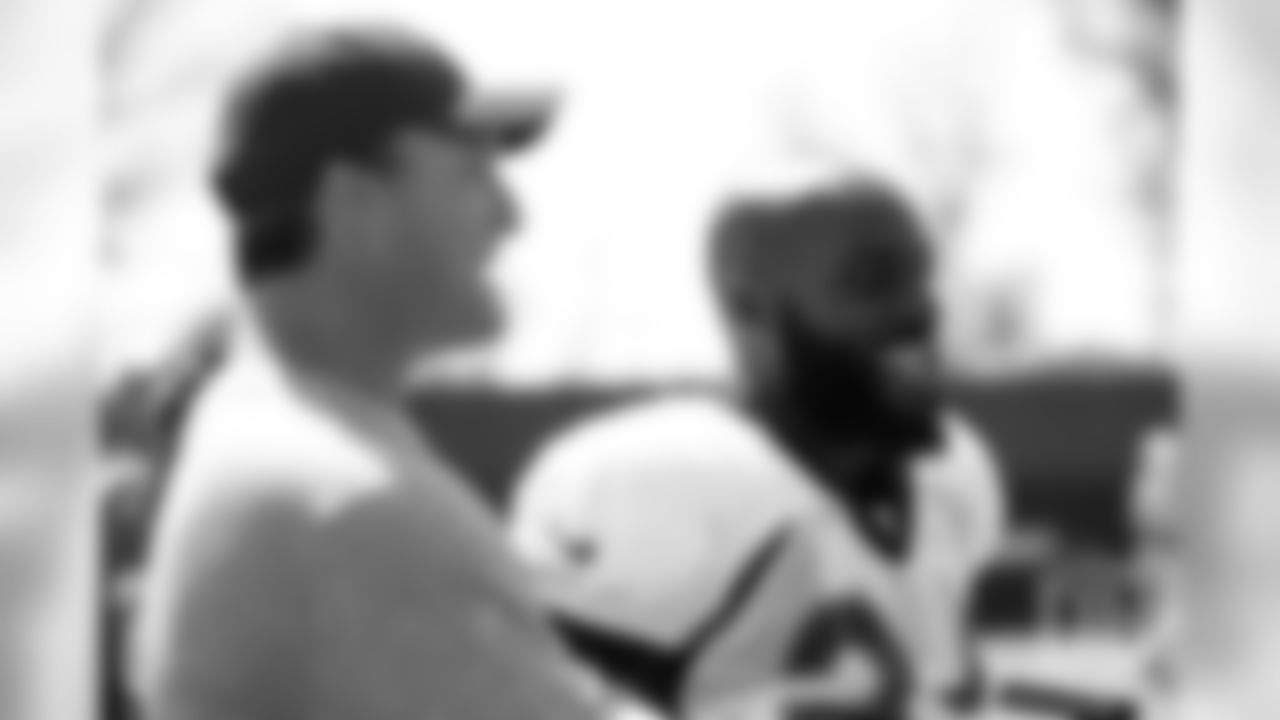 49ers general manager and former Broncos safety John Lynch with current Broncos safety Darian Stewart. (photo by Ben Swanson)