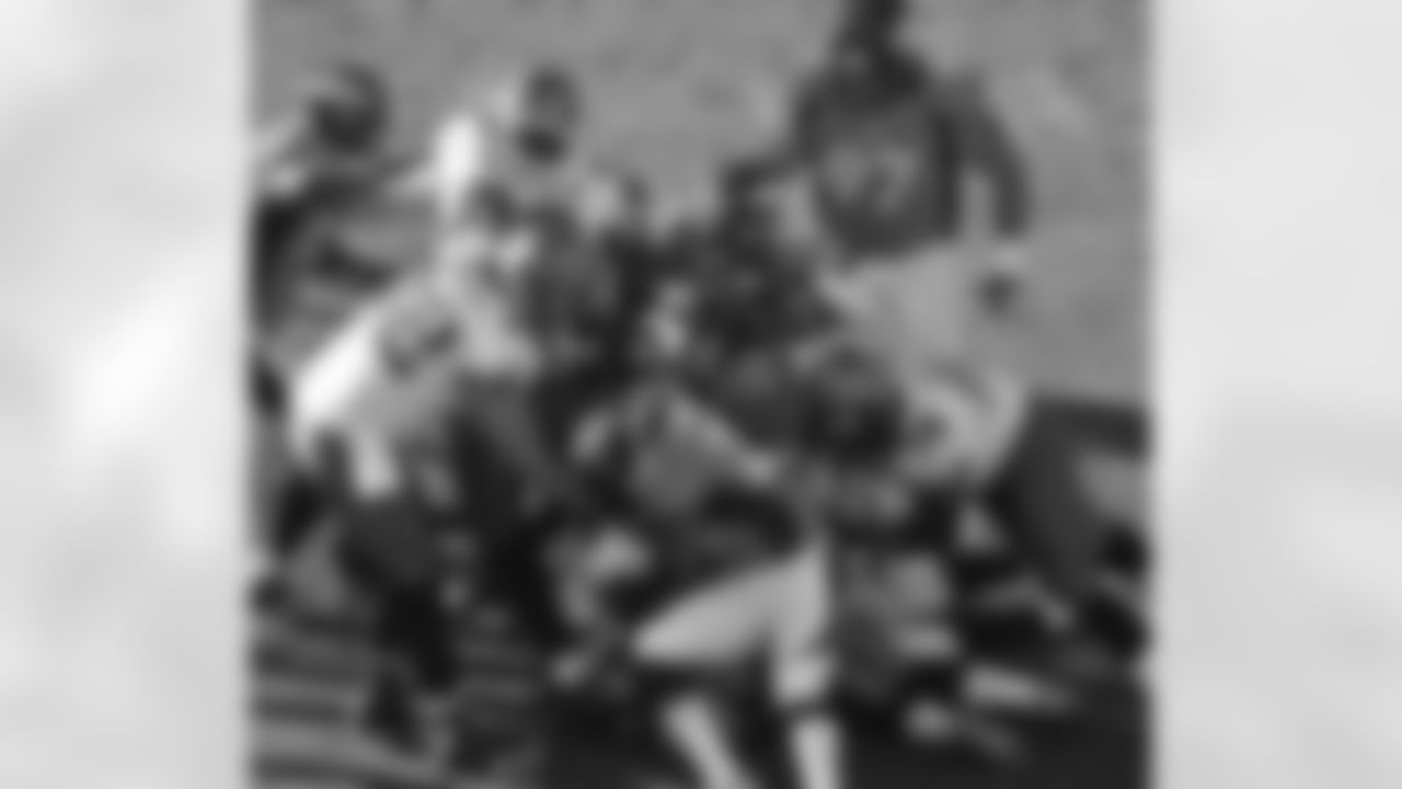 S Mike Adams and the Denver defense swarm to the football.