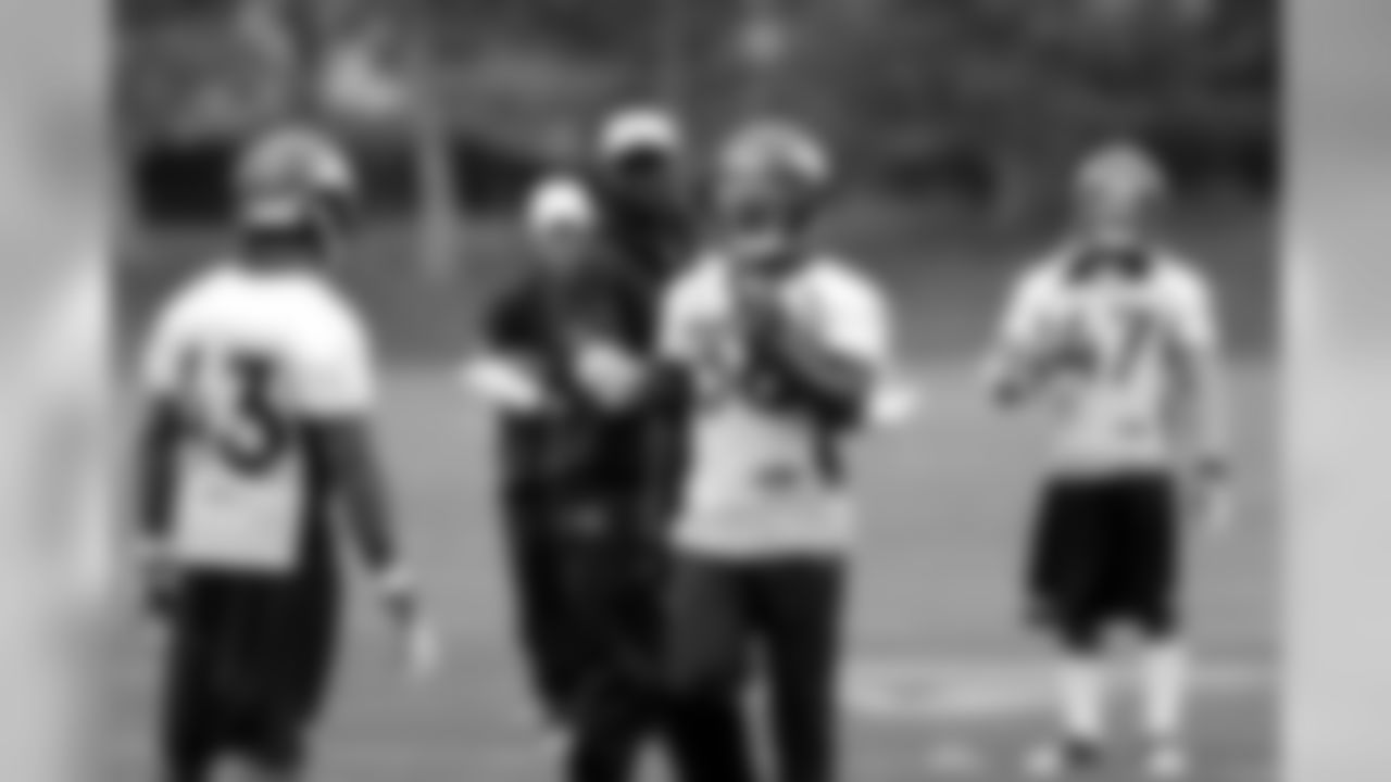 Assistant secondary coach Sam Garnes instructs the rookie defensive backs.