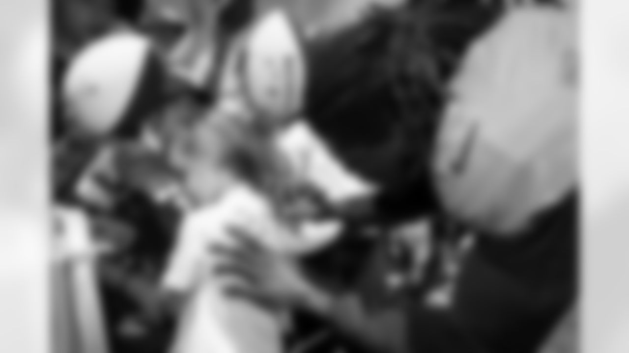 Randy Gregory signs autographs for fans during a training camp practice at Centura Health Training Center on August 1, 2023 in Englewood, Colorado. Photo by Ben Swanson / Denver Broncos