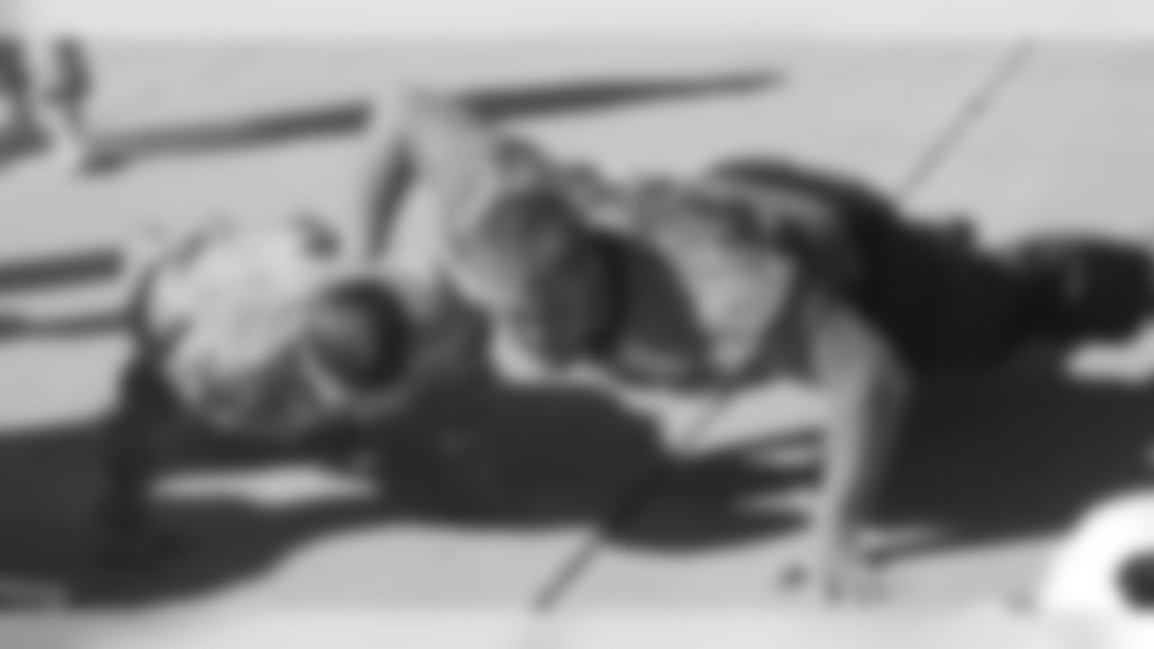 Garland looks for an advantage during a pushup competition with a soldier.