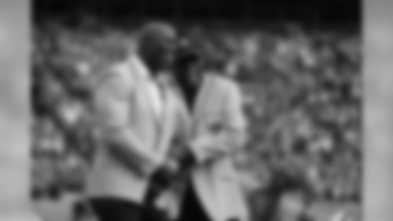 Terrell Davis and Floyd Little laugh during a ceremony celebrating Davis's induction into the Pro Football Hall of Fame before the game against the Cincinnati Bengals at Sports Authority Field at Mile High in Denver, Colo., November 19, 2017.
Photo by Gabriel Christus