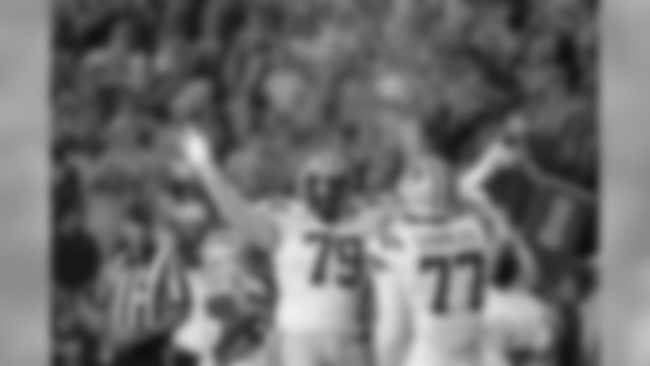 LSU center Lloyd Cushenberry III (79) and offensive tackle Saahdiq Charles (77) celebrate a touchdown in the first half of an NCAA college football game against Texas A&M in Baton Rouge, La., Saturday, Nov. 30, 2019. (AP Photo/Gerald Herbert)