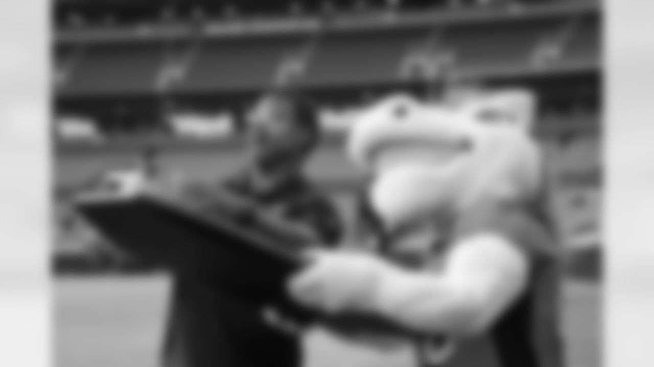 Steve Atwater and Miles the mascot act for a video unveiling the upgraded scoreboard at Empower Field at Mile High on August 21, 2023 in Denver, Colorado. Photo by Ben Swanson / Denver Broncos