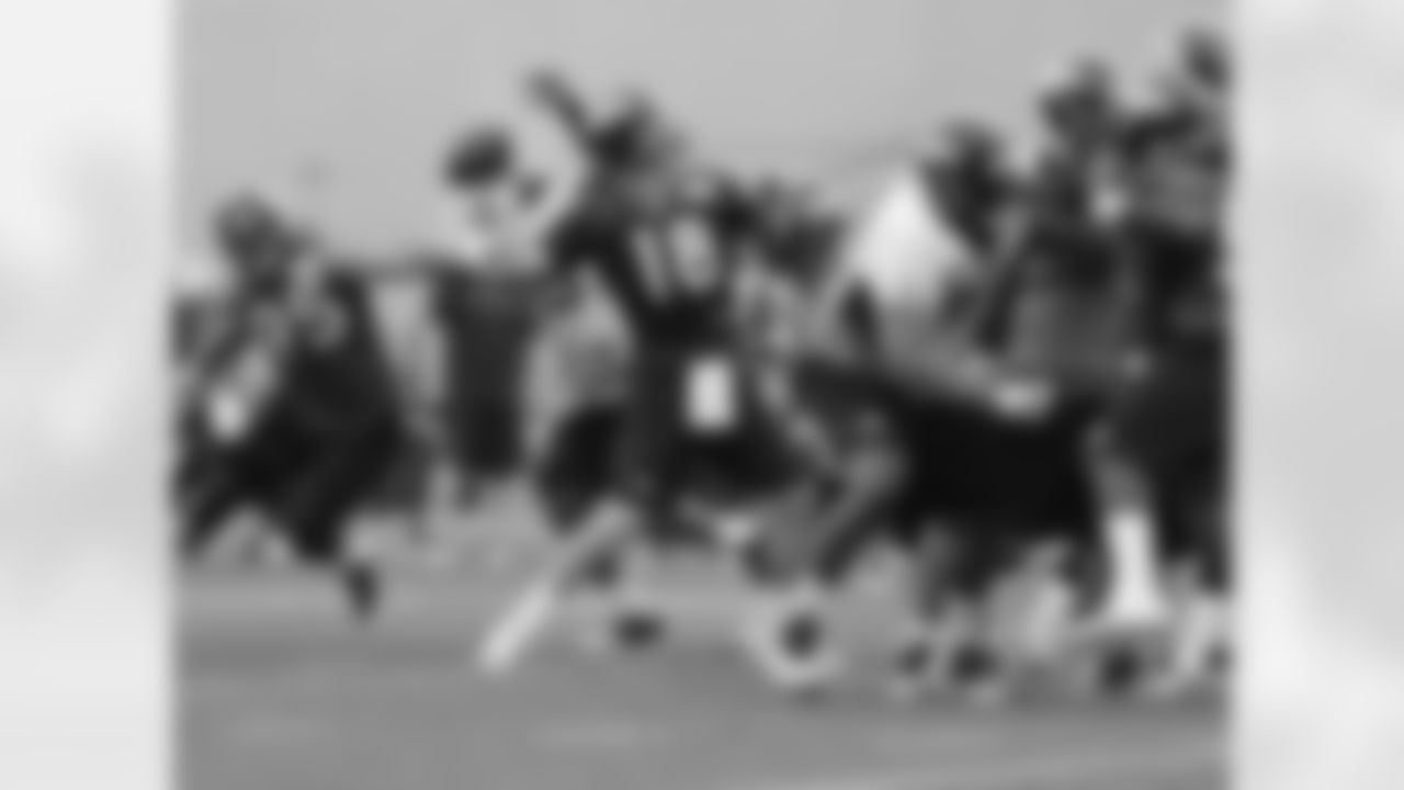 Manning throws a pass during full-team drills.