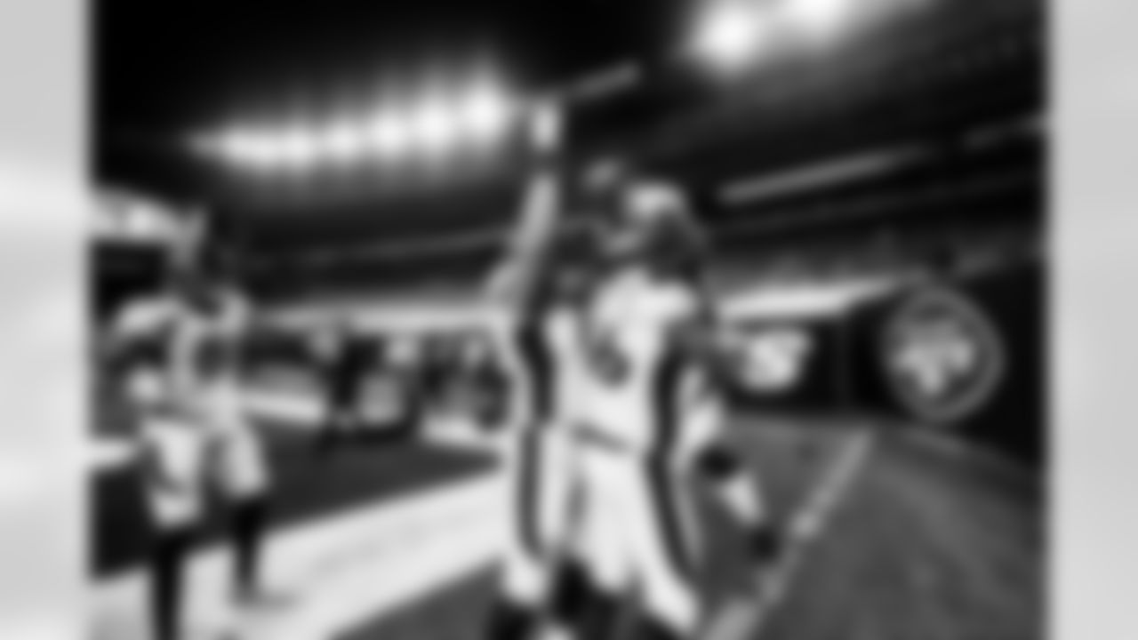 Dalton Risner congratulates Melvin Gordon III by lifting him in the air, as teammates Tim Patrick and Garett Bolles add their encouragement too, after Gordon scored a touchdown during the second half of the Broncos' Week 4 game against the New York Jets at MetLife Stadium in East Rutherford, New Jersey on October 1, 2020. (Photo by Ben Swanson)