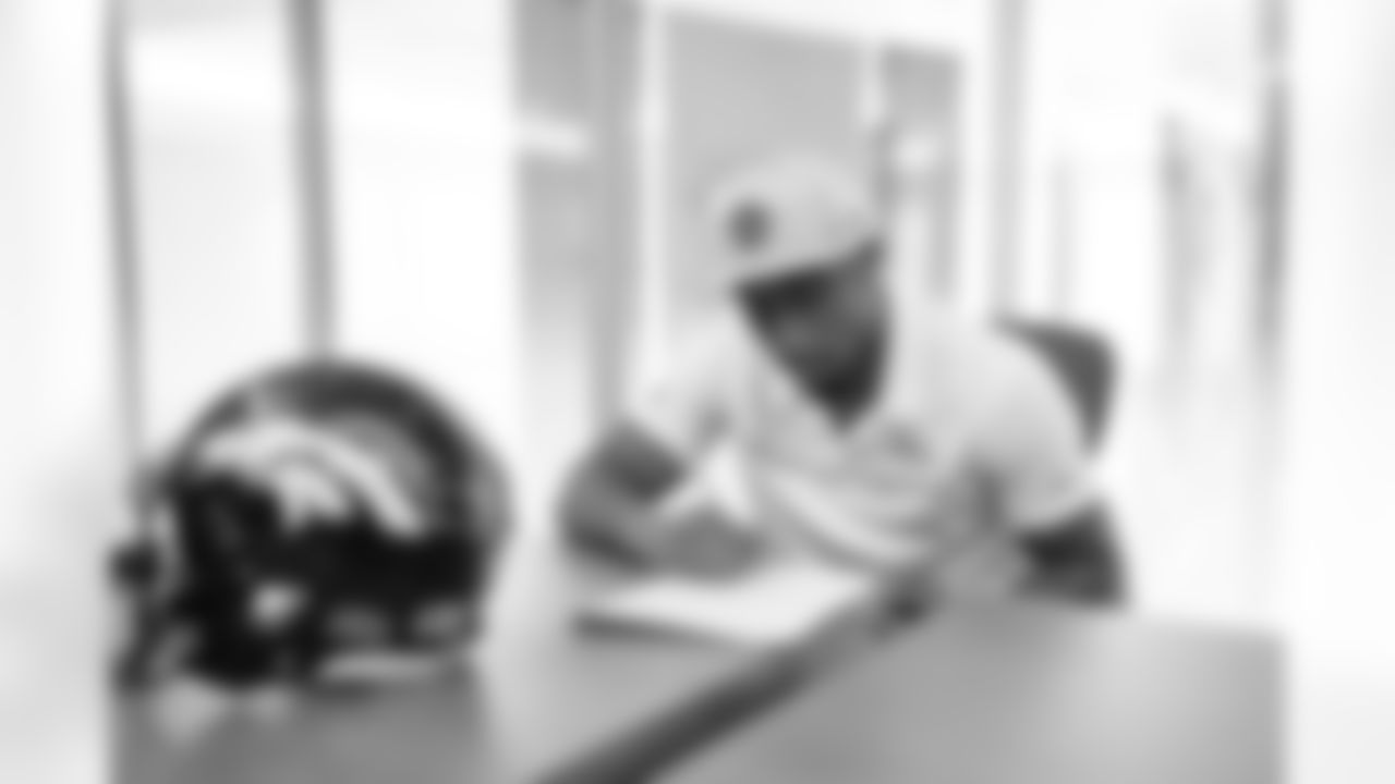 Free agent cornerback Ronald Darby signs his contract with the Broncos during his visit to UCHealth Training Center on March 18, 2021. (Photo by Joe Abdellah)