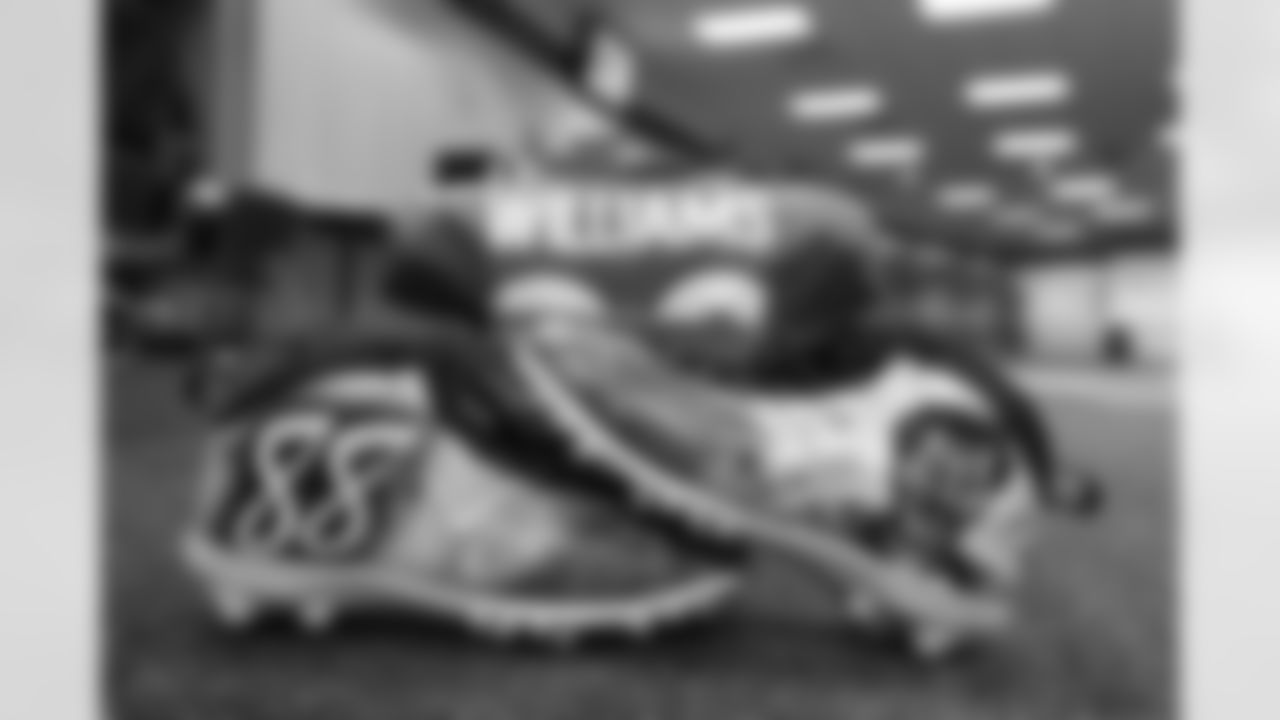 DeShawn WilliamsÕ cleats, a tribute to Demaryius Thomas, ahead of the Broncos Week 15 game vs. the Bengals at Empower Field at Mile High on Sunday, December 19, 2021.