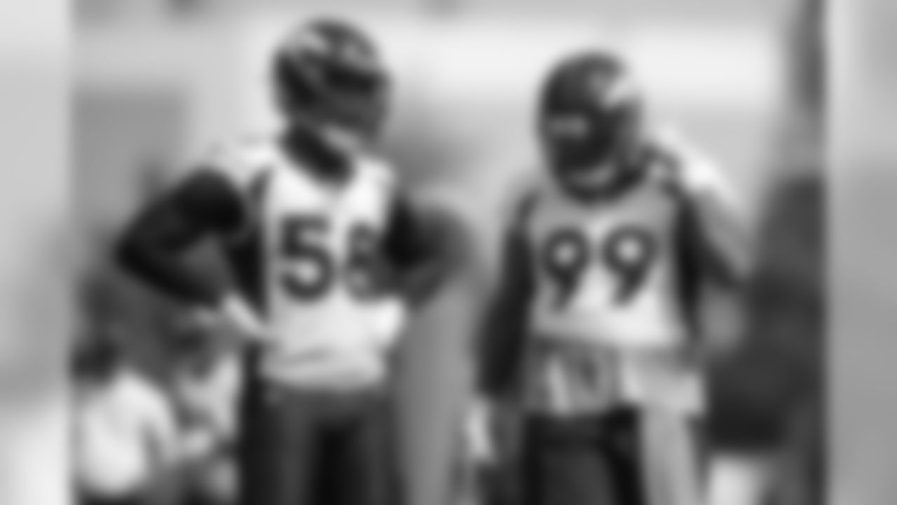 Von Miller and Jurrell Casey during the first training camp practice at UCHealth Training Center on August 14, 2020. (Photo by Ben Swanson)
