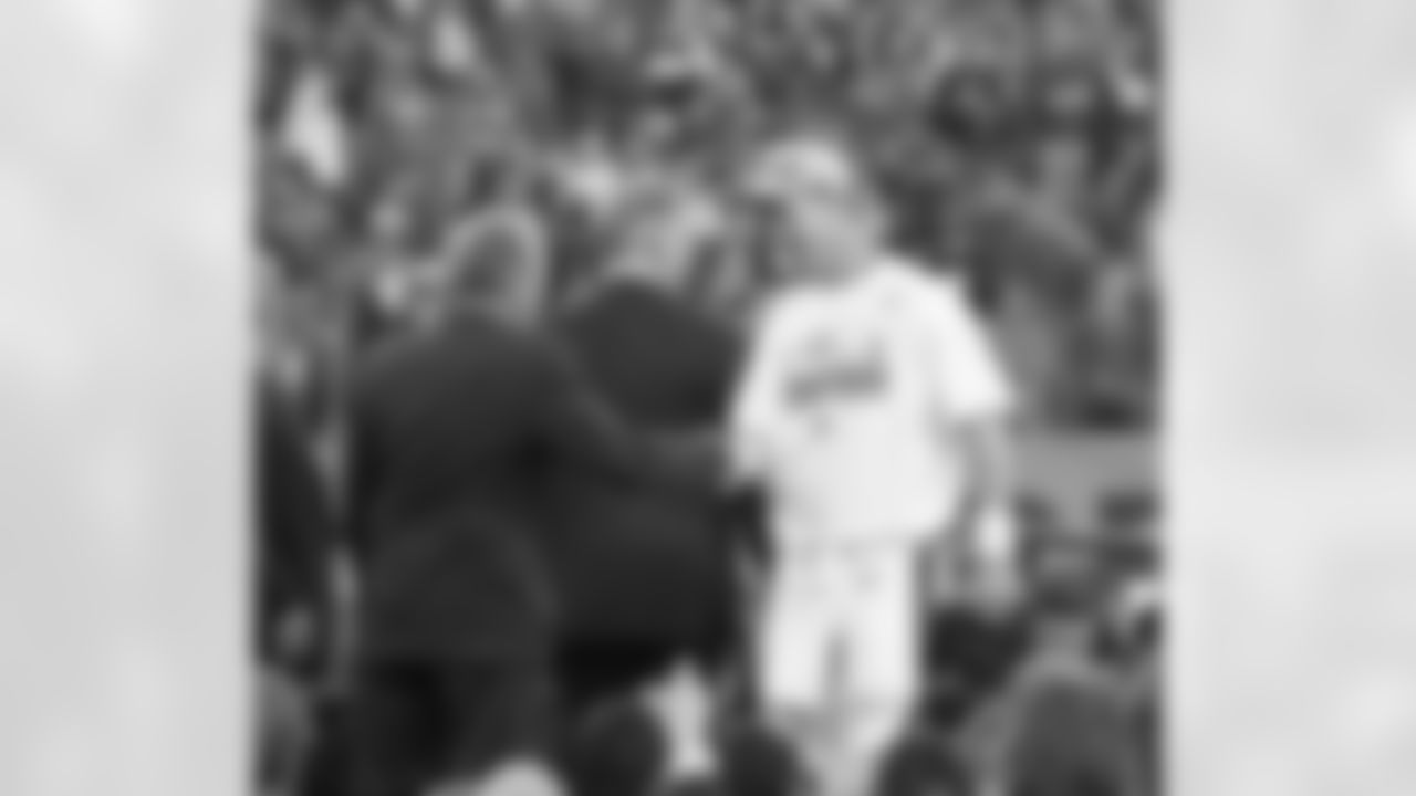 Denver Broncos quarterback Peyton Manning (18) shakes hands with Owner and CEO Pat Bowlen after action against the New England Patriots in the AFC Championship on January 19, 2014. This — getting back to the Super Bowl — was what Manning and Bowlen each had in mind when he joined the team almost two years earlier.