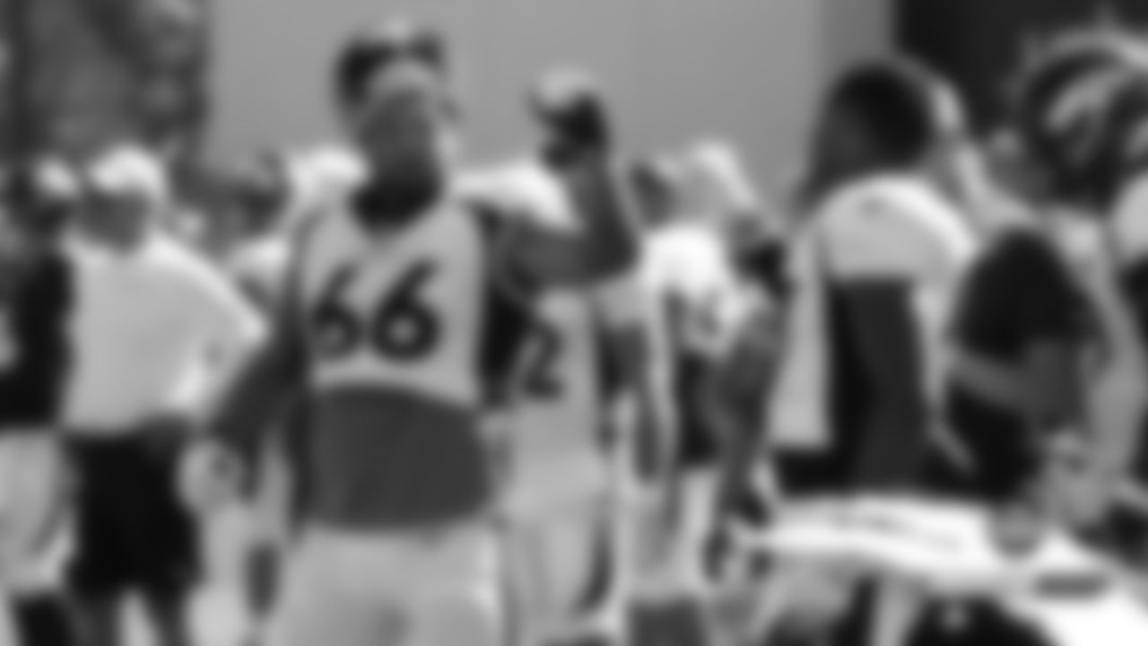 Dalton Risner celebrates with Noah Fant after Fant's touchdown catch during practice on Day 4 of training camp on July 21, 2019.
