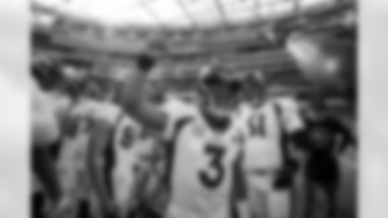 Russell Wilson speaks in the team huddle during pregame warmups before the Broncos' Week 16 game against the Los Angeles Rams at SoFi Stadium in Inglewood, California on December 25, 2022. Photo by Ben Swanson/DenverBroncos.com