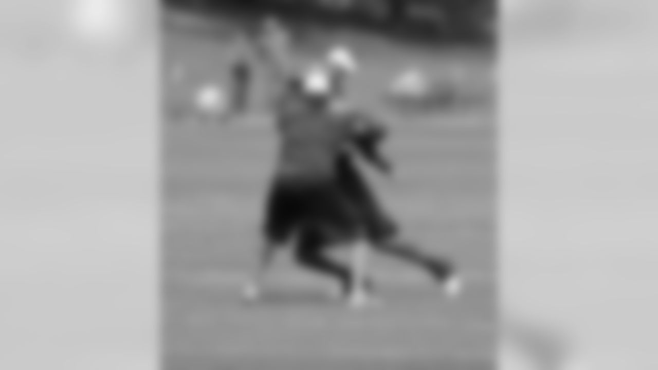 Thomas fights past QB Coach Adam Gase.
