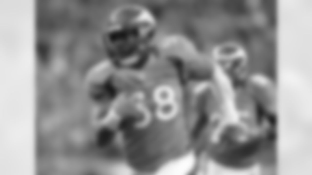 Denver Broncos linebacker Von Miller (58) runs the ball into the end zone for a touchdown after an interception during third quarter action against the Tampa Bay Buccaneers on Sunday Dec. 2, 2012 at Sports Authority Field at Mile High in Denver, Colorado.
(Photo by: Gabriel Christus)