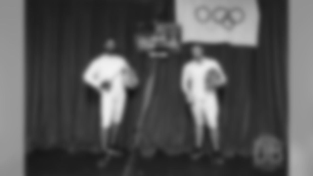 Brandon McManus and Casey Kreiter try their hands at fencing at the Denver Fencing Center on July 17, 2018.