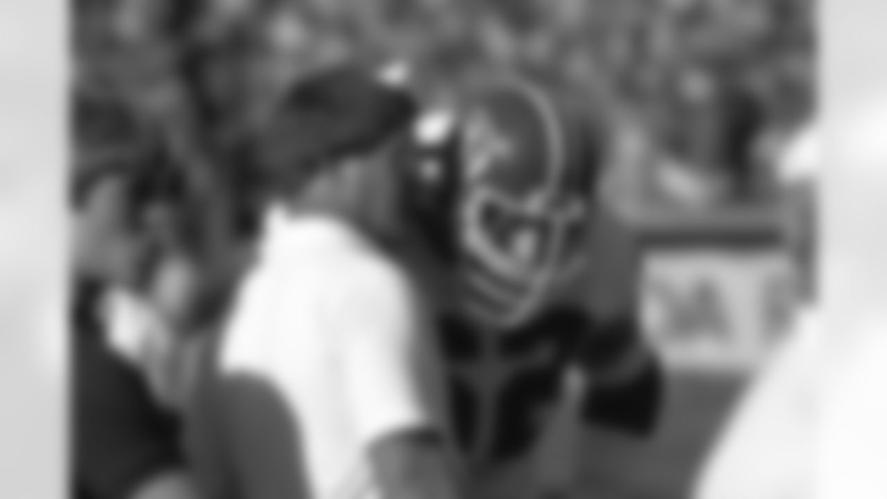 Coach Dan Reeves gives instructions to guard Tom Glassic during an October 1983 game.