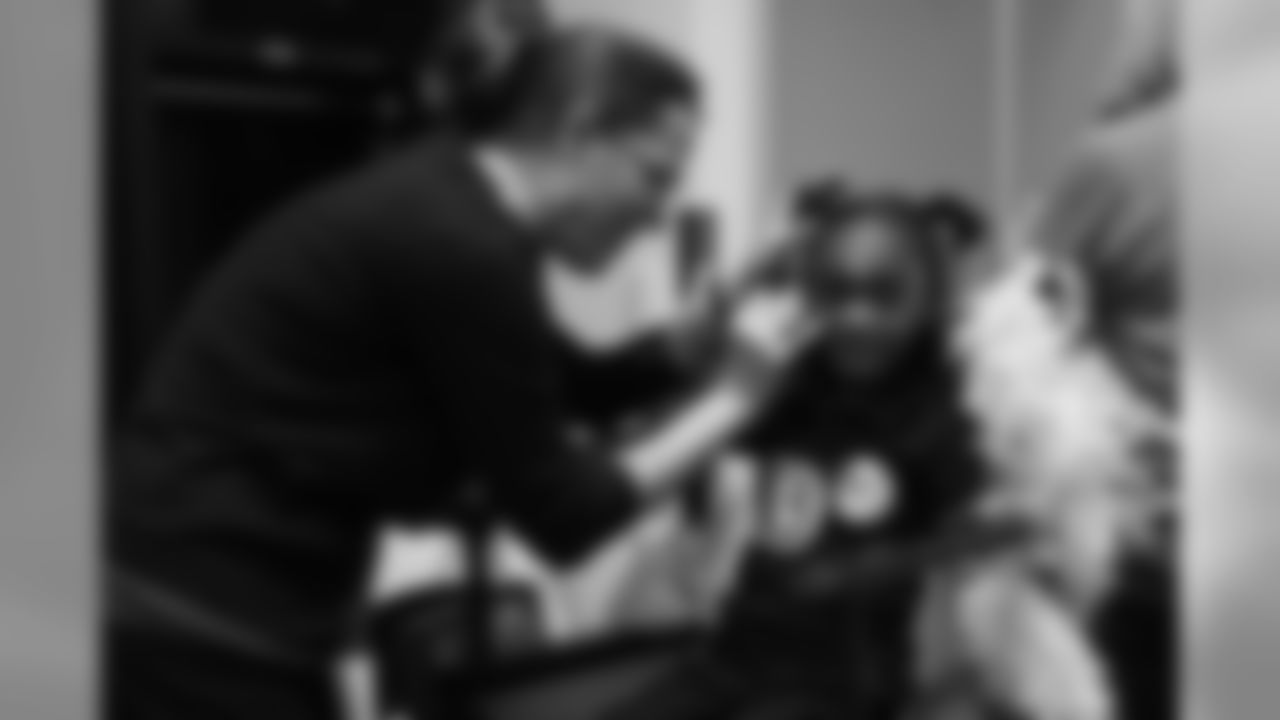 A young girl gets her face painted at the Broncos' Boys & Girls Club holiday party for about 200 children from the Boys & Girls Clubs of Metro Denver at UCHealth Training Center on December 17, 2018.