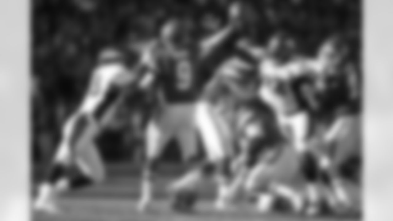 Miller and Dumervil converge on Chiefs QB Brady Quinn.